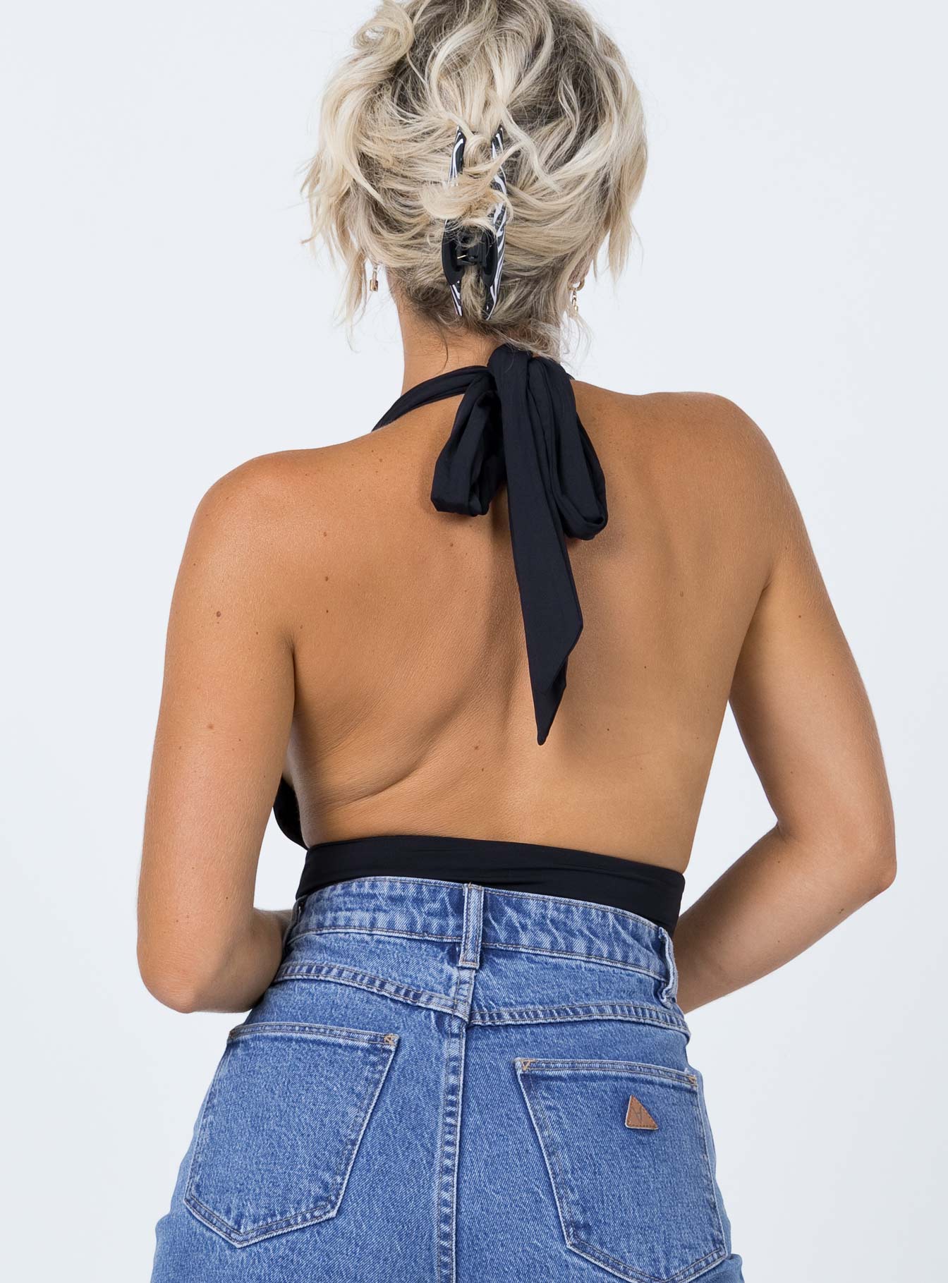 back view of model wearing Princess Polly Jordy Bodysuit Black Sleeveless Plunger 