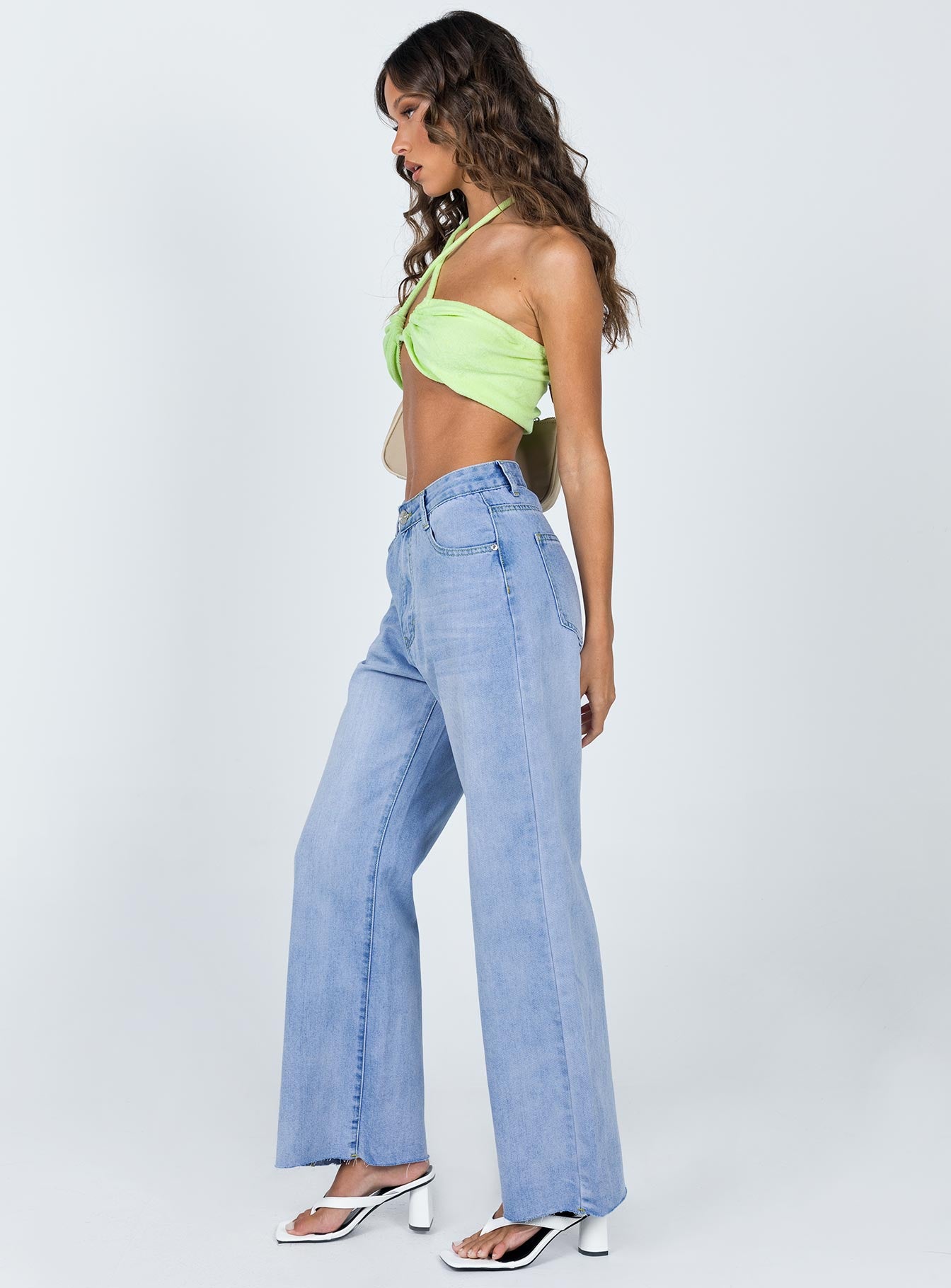 side view of model wearing Princess Polly Cece Hammer Wide Leg Jeans Vintage Blue Denim Mid Rise 