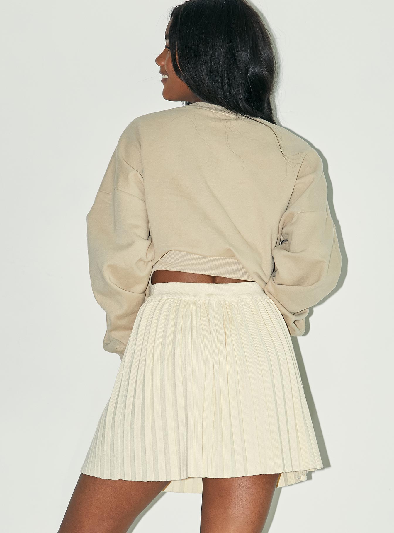 back view of model wearing Princess Polly Noelle Mini Skirt Cream 