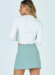 back view of model wearing Princess Polly Selby Mini Skirt Green 