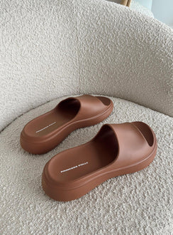 Brown slides Rubber design  Single wide upper  Platform base  Lightweight 