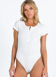 front view of model wearing Princess Polly Barcham Bodysuit White Short Sleeves Crew Neck 