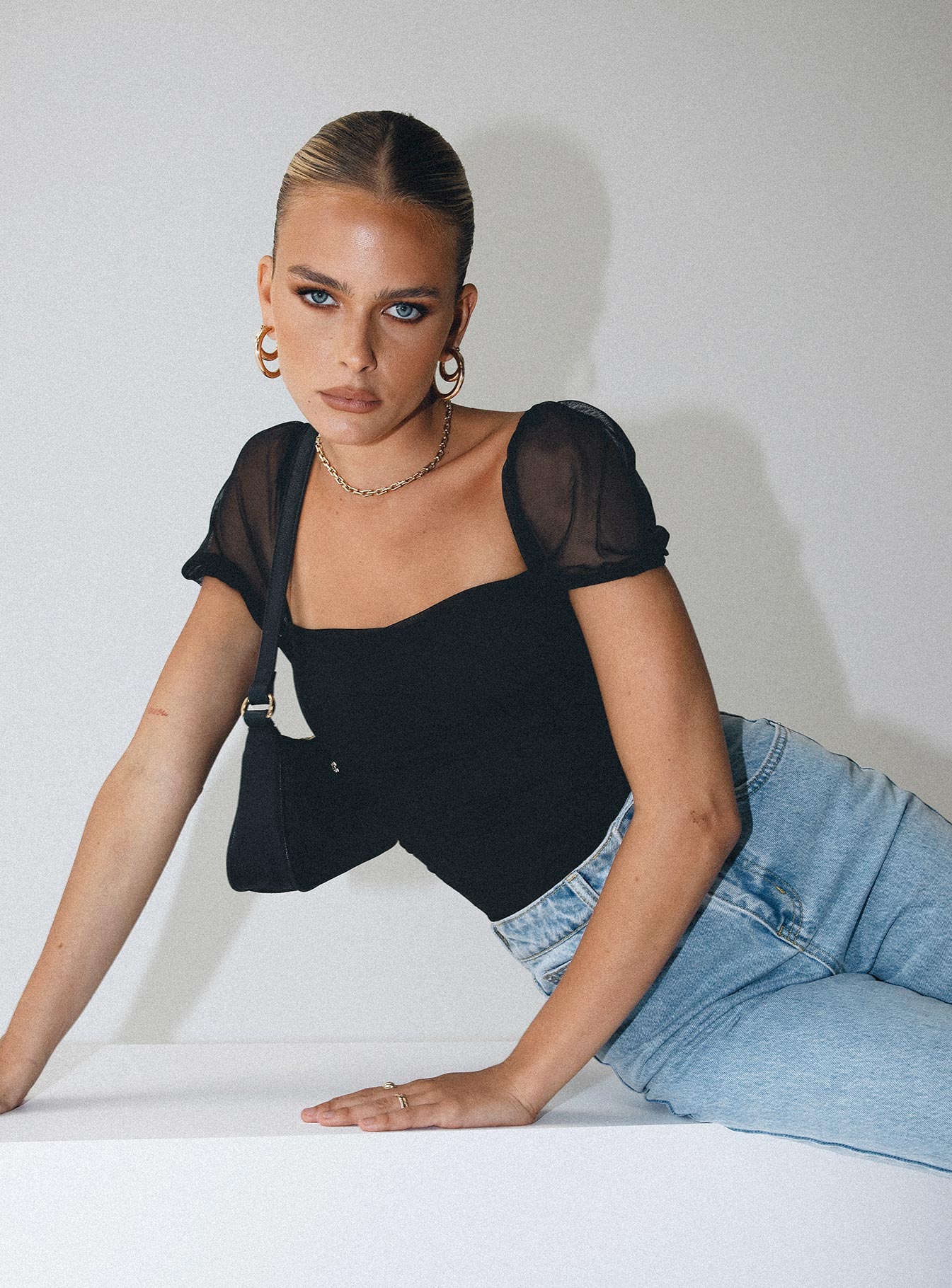 front view of model wearing Princess Polly Dostan Bodysuit Black Short Sleeves 