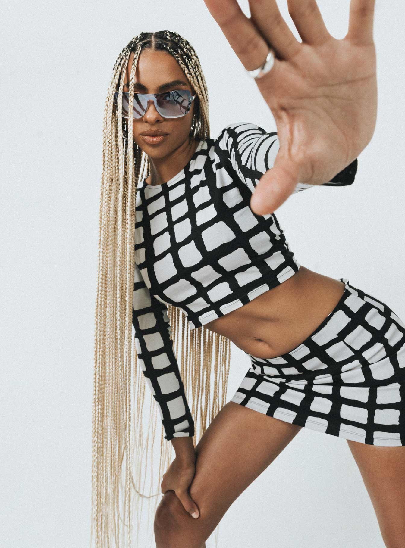 side view of model wearing Princess Polly Motel Bonnie Top Mesh Mono Painted Check Full Sleeves Crew Neck 