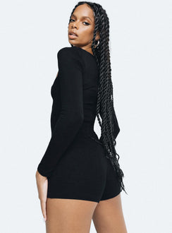 Black long sleeve playsuit Ribbed material Square neckline Invisible zip fastening at back Good stretch