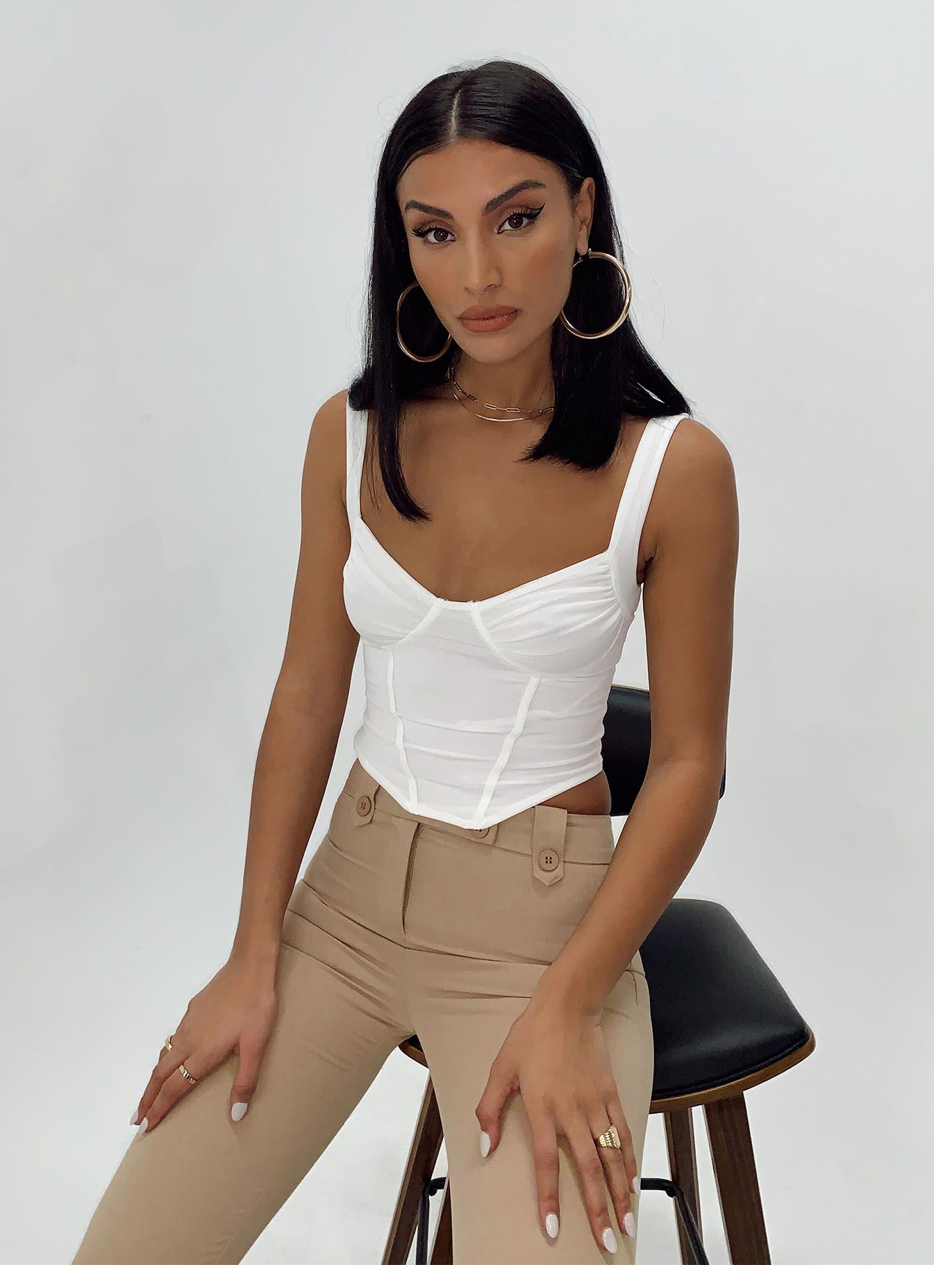 Front view of model wearing  front Princess Polly Sleeveless Square Neck  Bruna Top White Low Impact