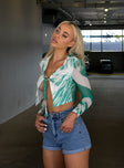 side view of model wearing Princess Polly Clyde Long Sleeve Top Green 