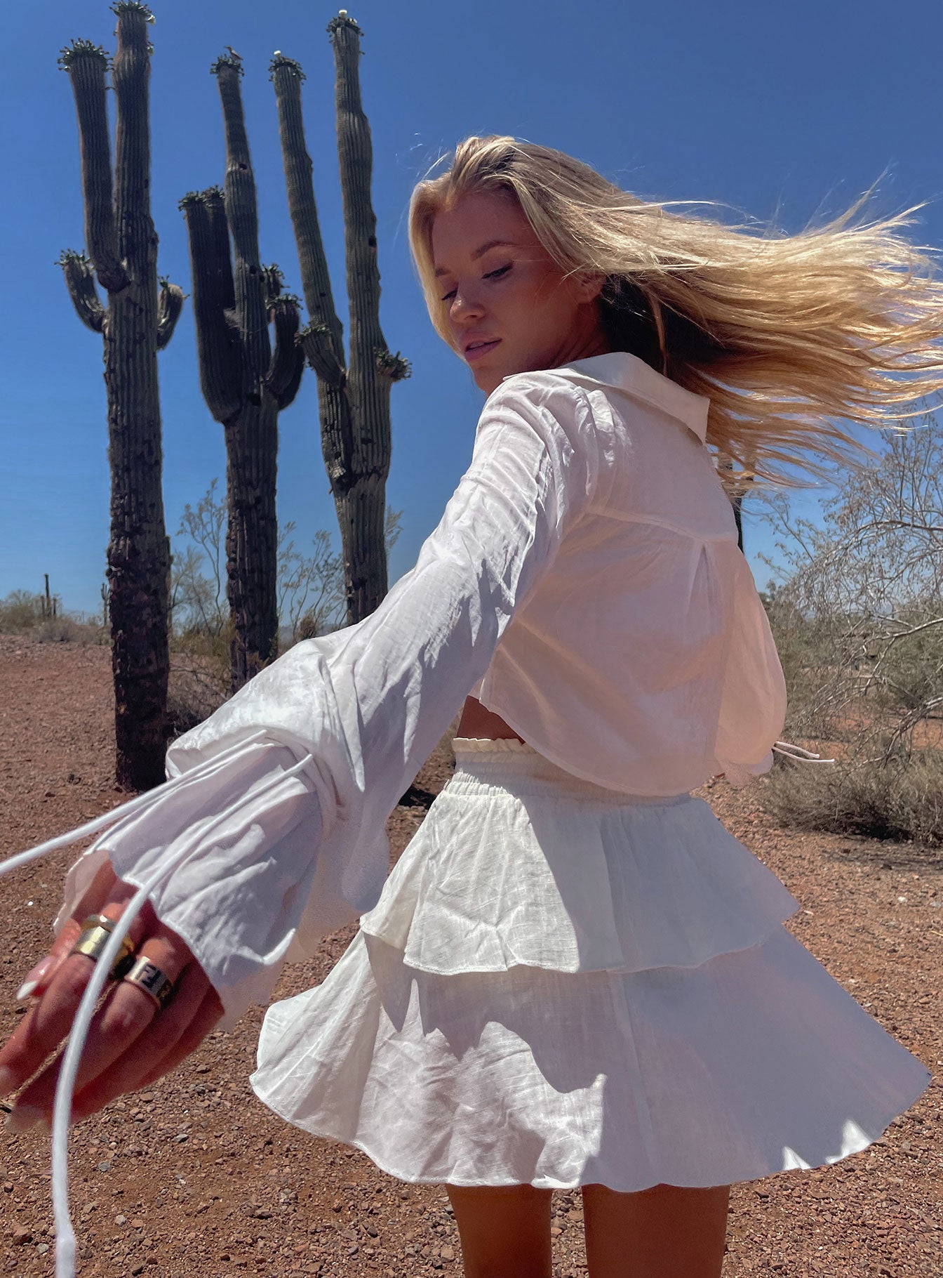 back view of model wearing Princess Polly Greta Mini Skirt Off White 