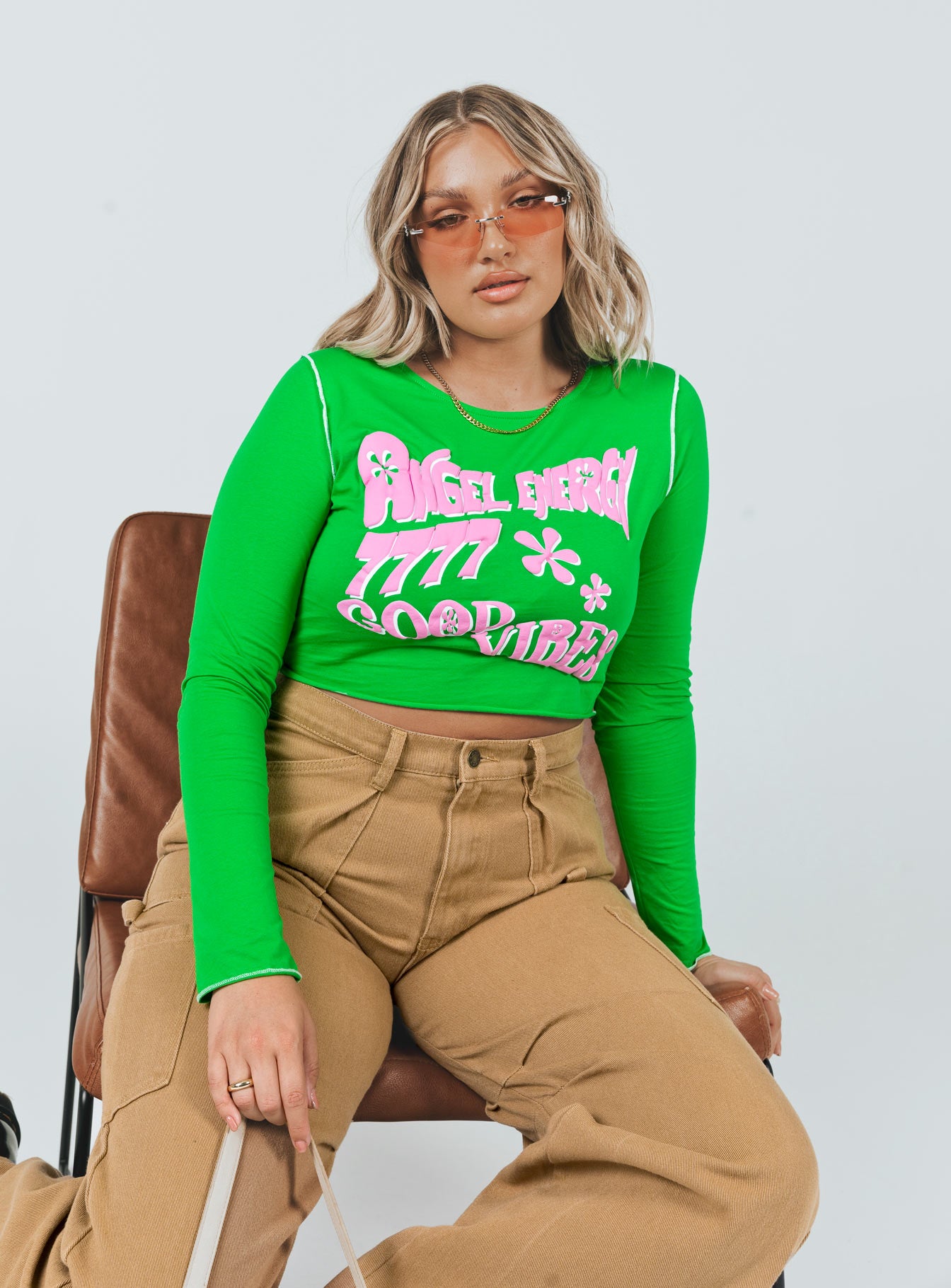 front view of model wearing Princess Polly Good Vibes Long Sleeve Top Green 