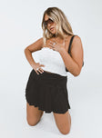   front view of model wearing Princess Polly Arlo Tennis Skirt Black 