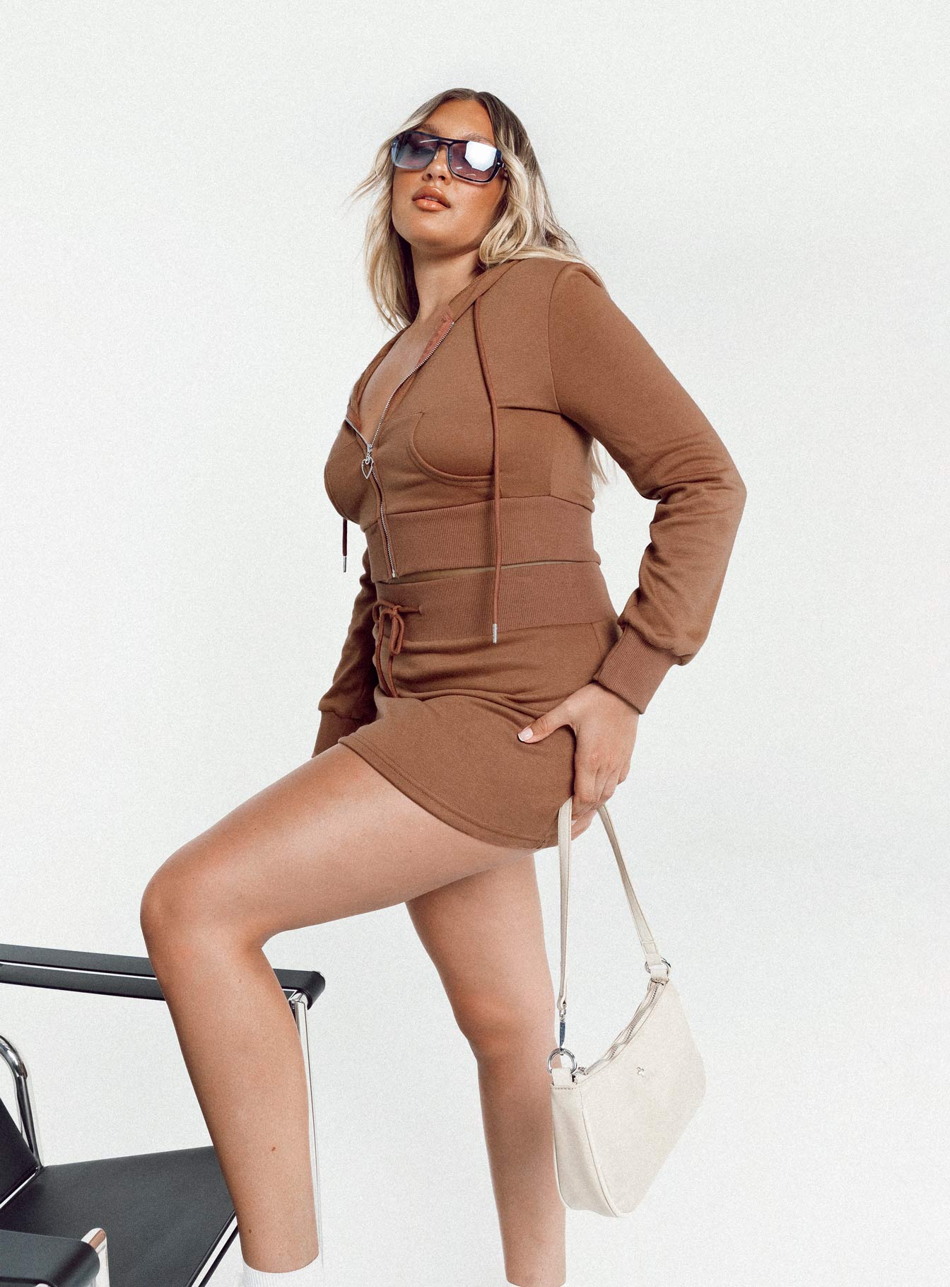   side view of model wearing Princess Polly Jaded Y2k Terry Mini Skirt Brown 