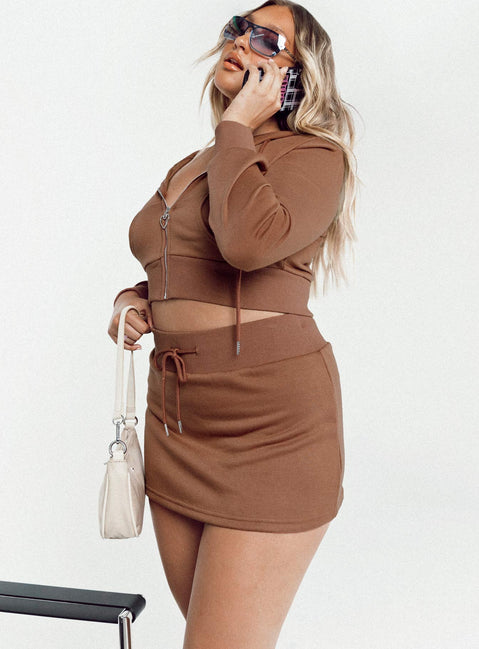   side view of model wearing Princess Polly Jaded Y2k Terry Mini Skirt Brown 