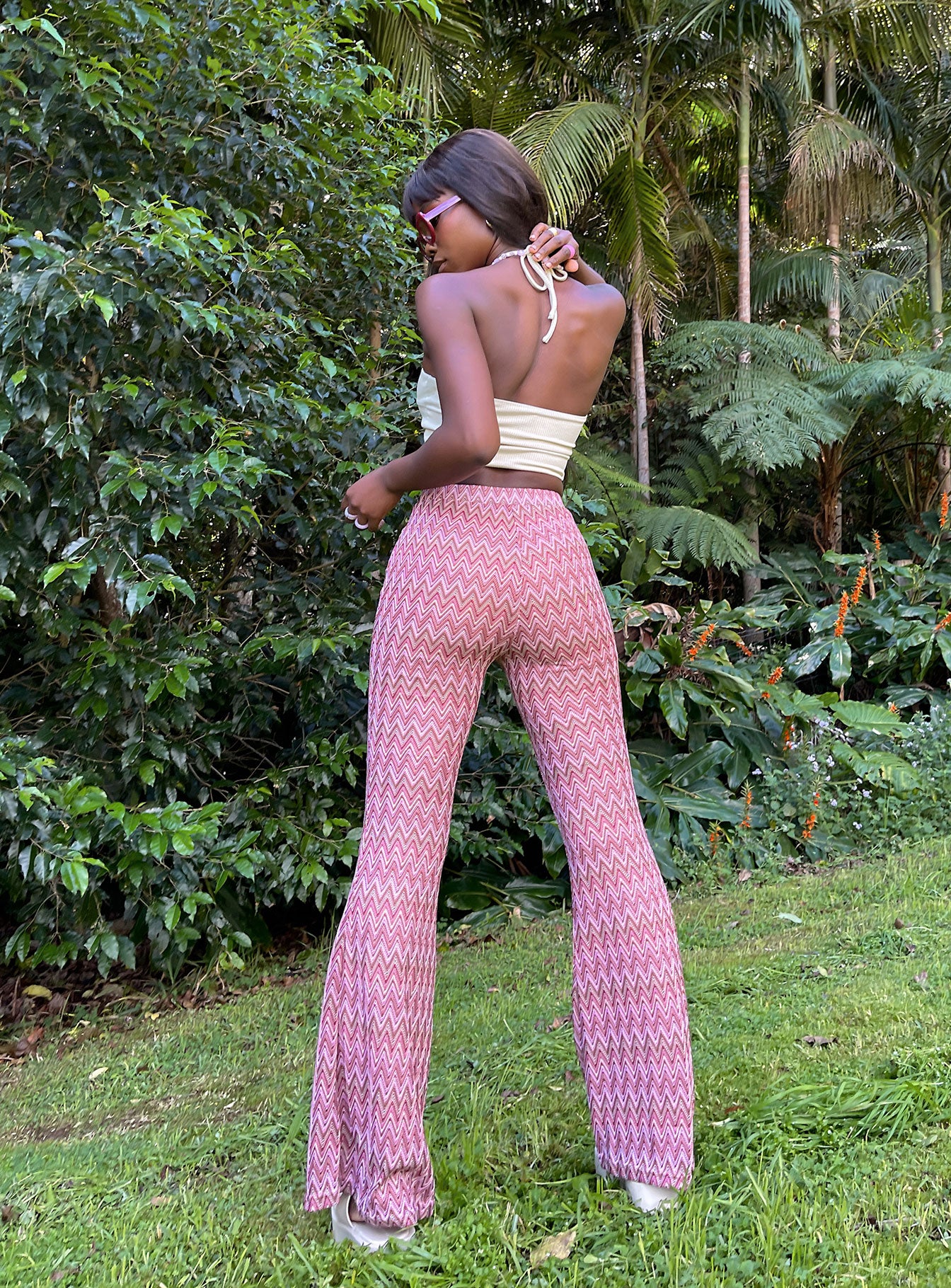 back view of model wearing Princess Polly Karmen Chevron Knit Flare Pants Pink 