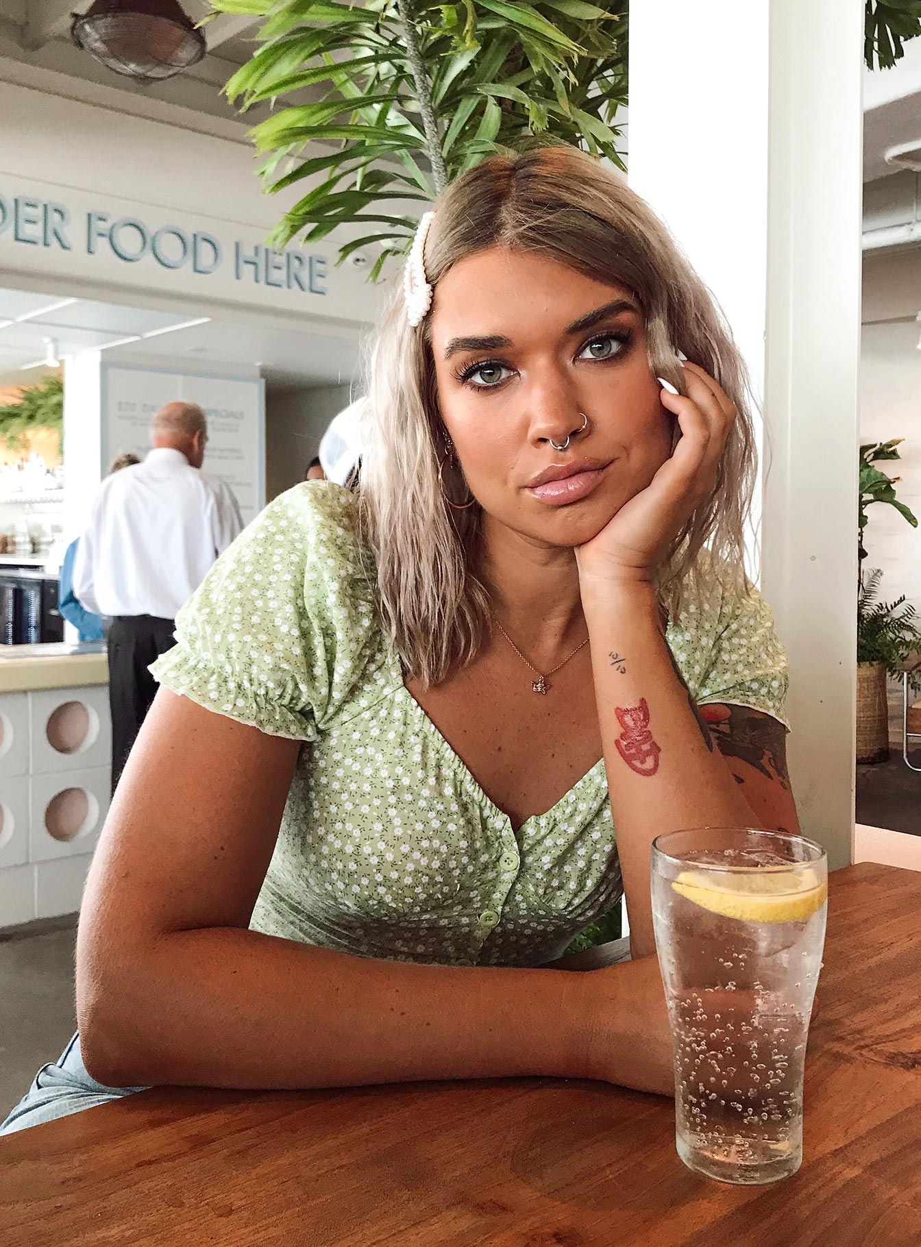 Front view of model wearing  front Princess Polly Short Sleeves Cowl  Laguna Top Green