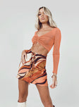 side view of model wearing Princess Polly Lucille Long Sleeve Top Orange 