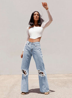 front view of model wearing Princess Polly Maple Flare Jeans Knee Rips Light Wash Denim Mid Rise 