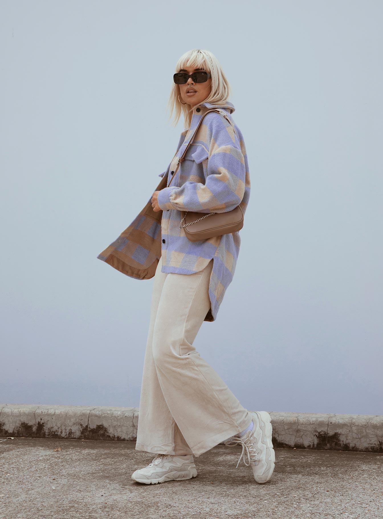 side view of model wearing Princess Polly Motel Obeli Trouser Rib Cream 