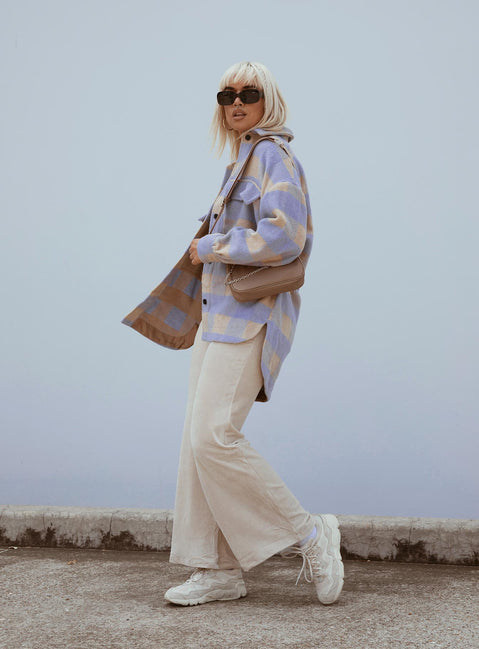 side view of model wearing Princess Polly Motel Obeli Trouser Rib Cream 