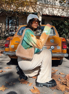 side view of model wearing Princess Polly Motel Obeli Trouser Rib Cream 