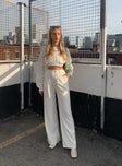 Matching set Crop top Fixed straps Invisible zip fasting at side High waisted pants Wide relaxed leg Belt loops at waist Zip & button fastening Stuble pleats at waist Twin hip pockets