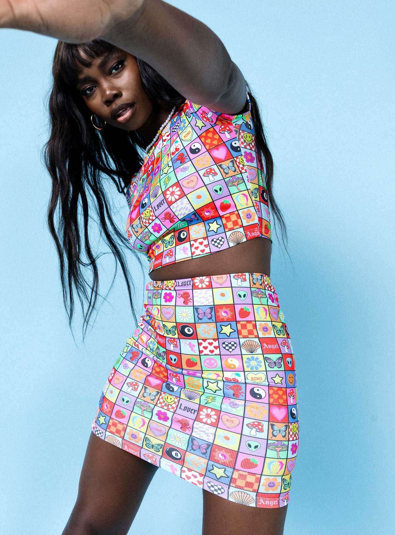 back view of model wearing Princess Polly Pixel Mania Mini Skirt Multi 