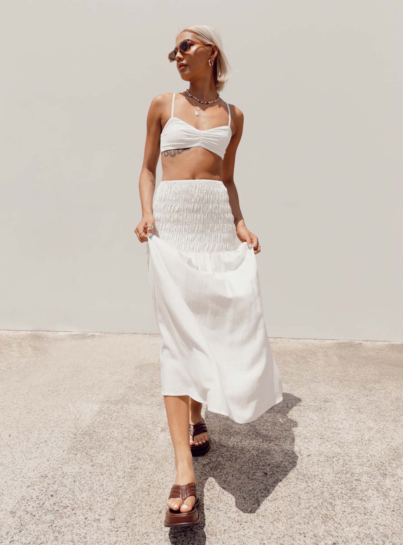   side view of model wearing Princess Polly Porto Maxi Skirt White Maxi 