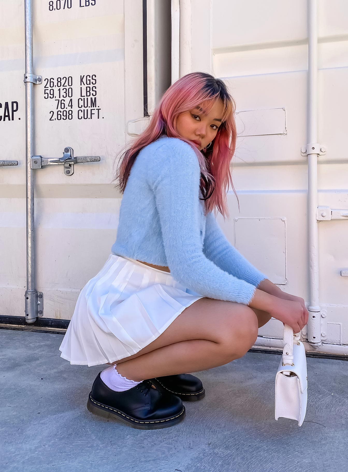   side view of model wearing Princess Polly Rosella Mini Skirt 