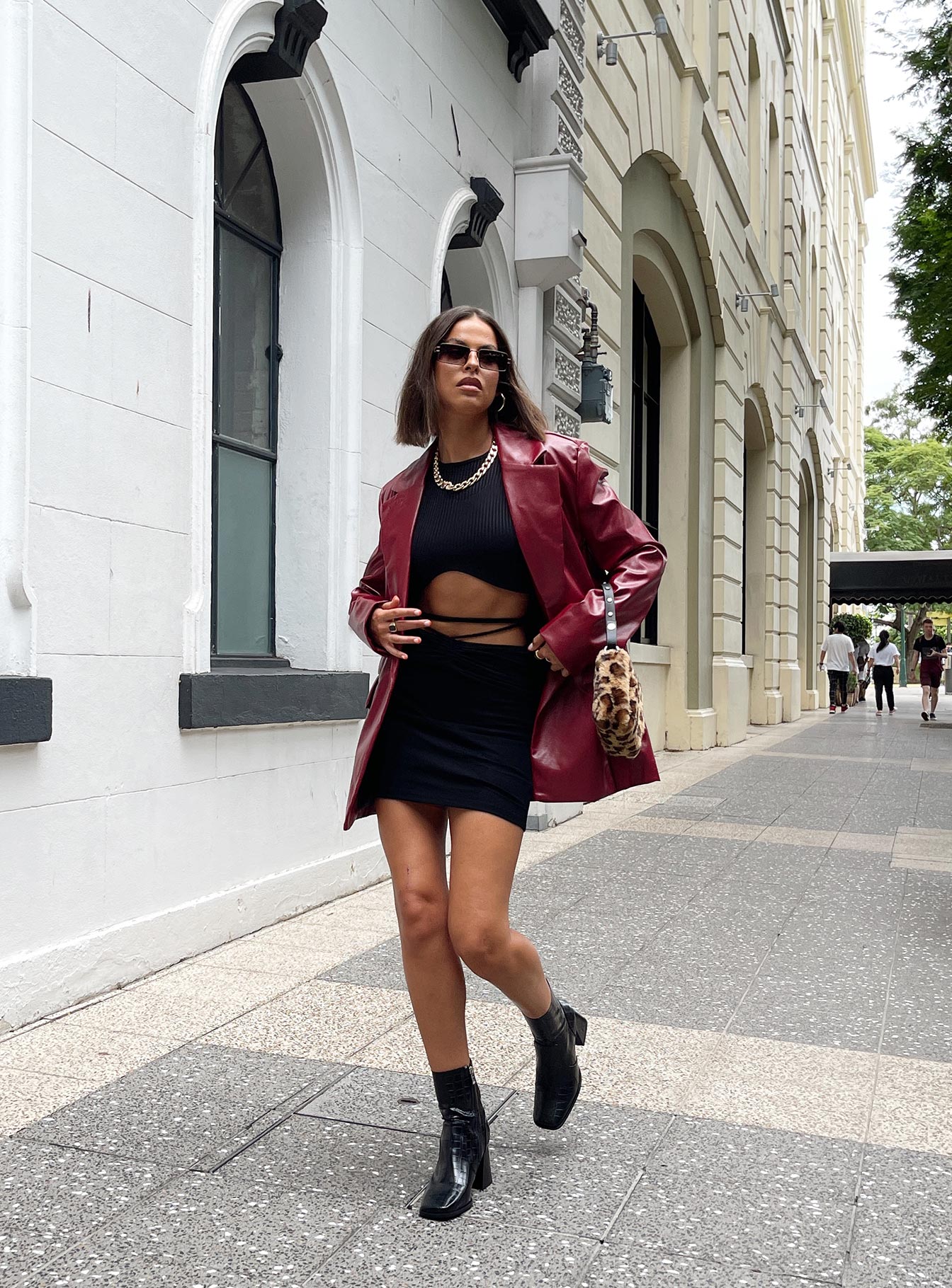   side view of model wearing Princess Polly Dom Mini Skirt Black 