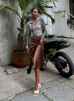   side view of model wearing Princess Polly Tyra Satin Midi Skirt Brown 