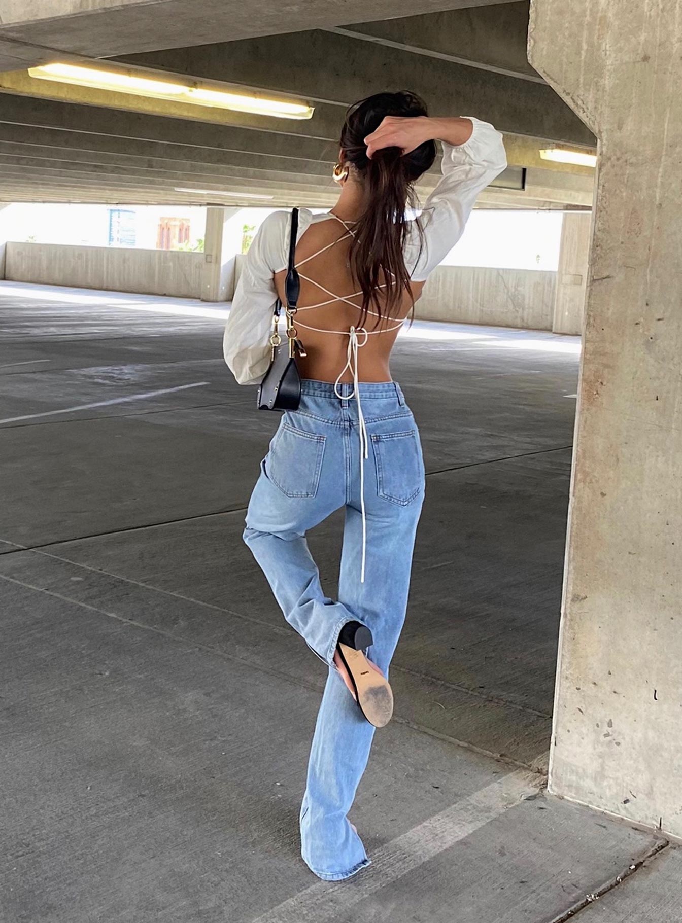 back view of model wearing Princess Polly Alabama Jean Mid Rise 