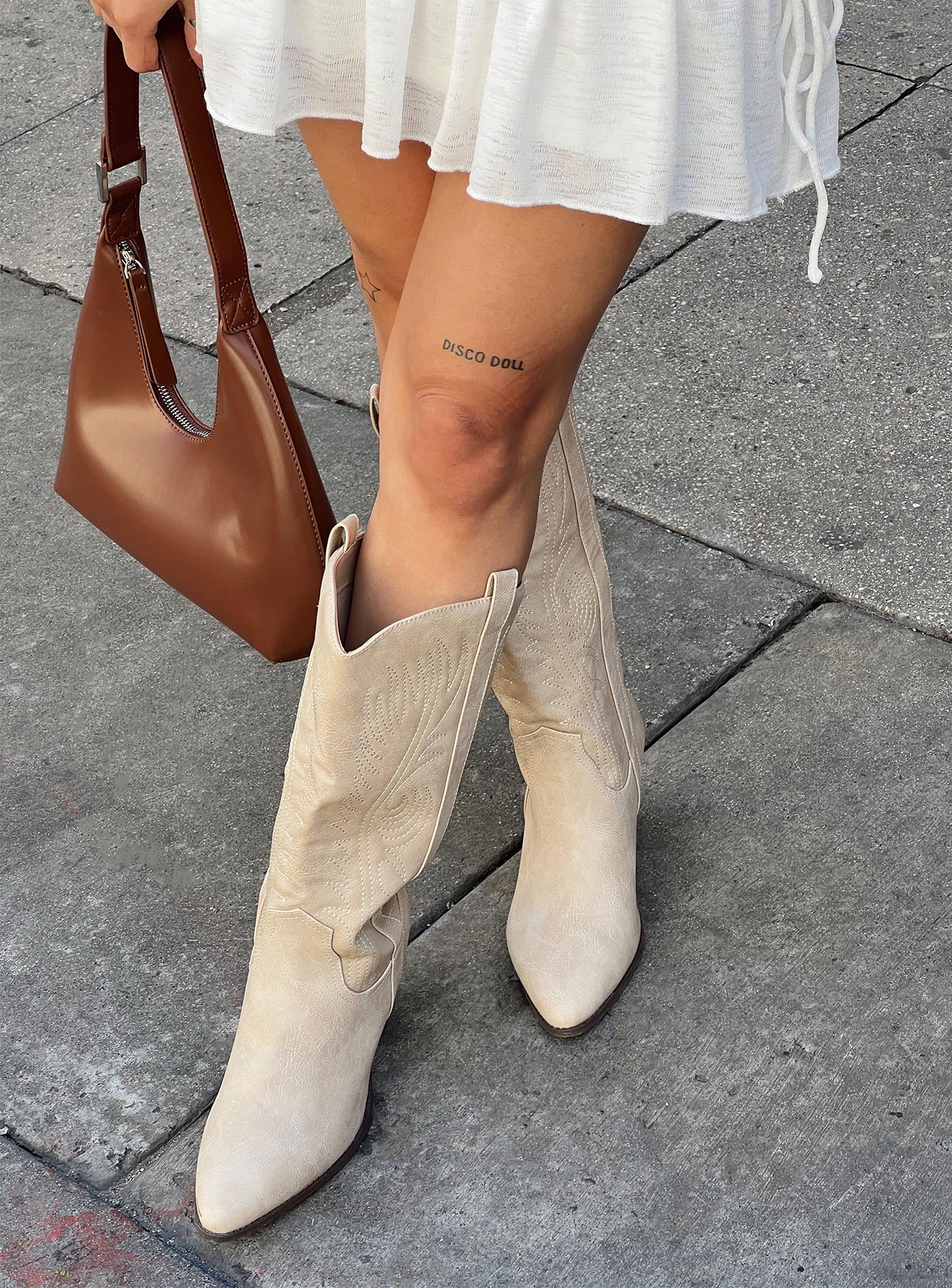 Cowgirl boots Faux leather material  Detail stitching  Mid calf length  Pull tabs  Pointed toe Block heel 