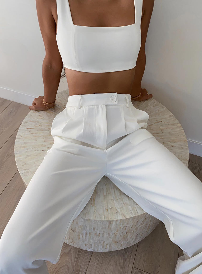 Matching set Crop top Fixed straps Invisible zip fasting at side High waisted pants Wide relaxed leg Belt loops at waist Zip & button fastening Stuble pleats at waist Twin hip pockets