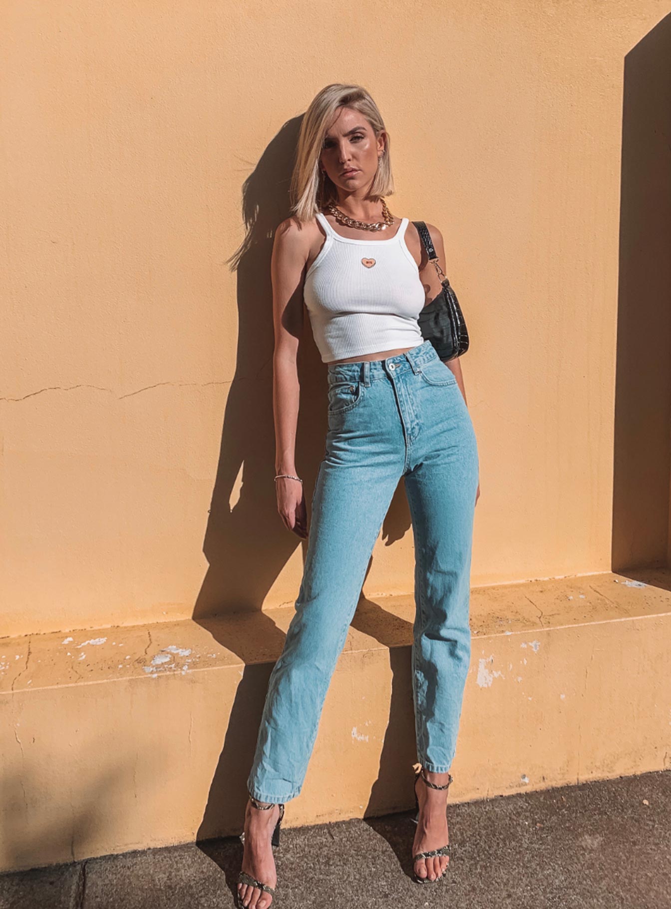 front view of model wearing Princess Polly Ragged Priest Cougar Jean Mid Rise 